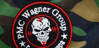 PMC Wagner Group patch on camouflage background.