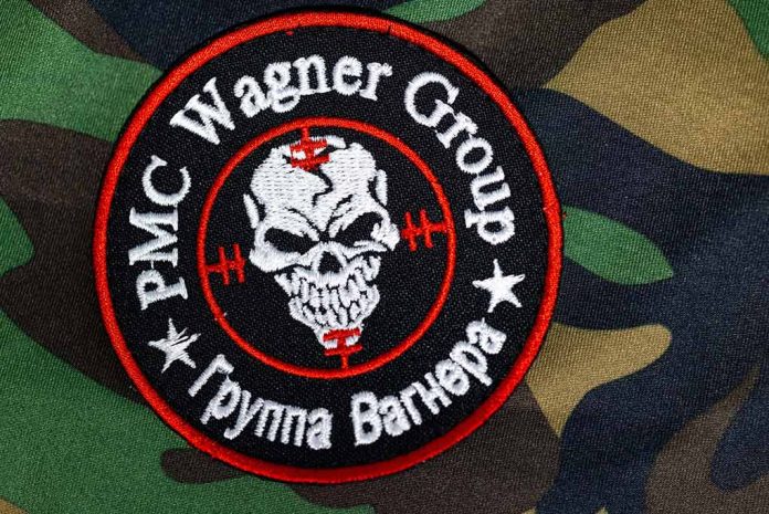 2324824963 featured image PMC Wagner Group patch on camouflage background.