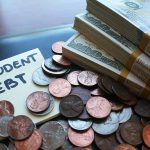 Note with student debt coins and banknotes