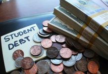 Note with student debt coins and banknotes