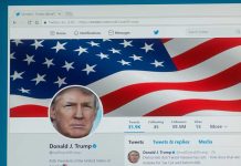 Twitter profile page with American flag banner