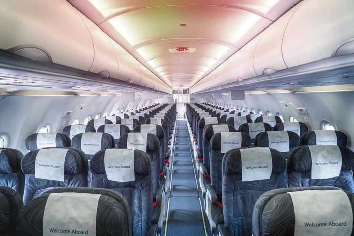 1889559274 Empty airplane cabin with rows of seats