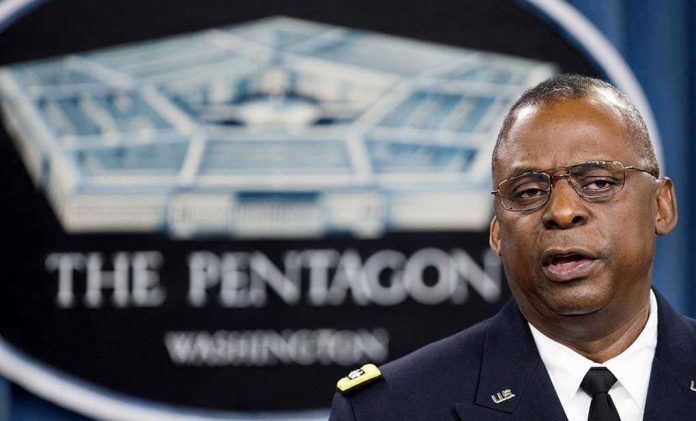2027618987 Man speaking in front of Pentagon sign