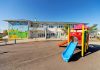 Colorful playground slide in front of a building