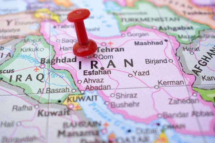 2237379503 Red pushpin marking Iran on a map