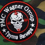 PMC Wagner Group patch on camouflage background