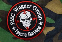 PMC Wagner Group patch on camouflage background