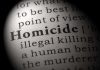 Magnified text showing definition of homicide