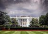 White House front view with dark clouds above