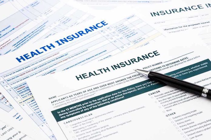 shutterstock_190551629.jpg Close up of health insurance application forms with a pen