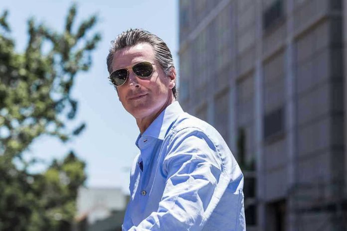 1677676426 Man in sunglasses wearing a blue button-up shirt.