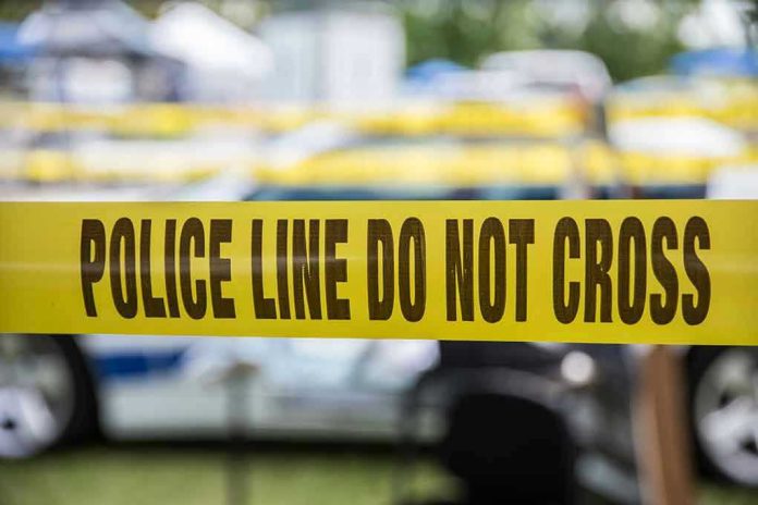 627591236 Yellow police line tape with Do Not Cross