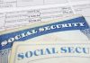 Close-up of social security cards and tax documents showing financial information