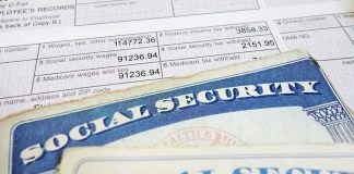 Close-up of social security cards and tax documents showing financial information