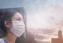 Person wearing a mask in a cityscape background