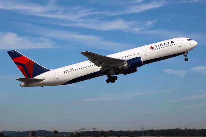 Delta Airlines airplane taking off against a blue sky