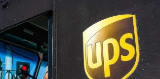 UPS Tariff NIGHTMARE—200% Price Increase! UPS delivery truck driver at traffic light