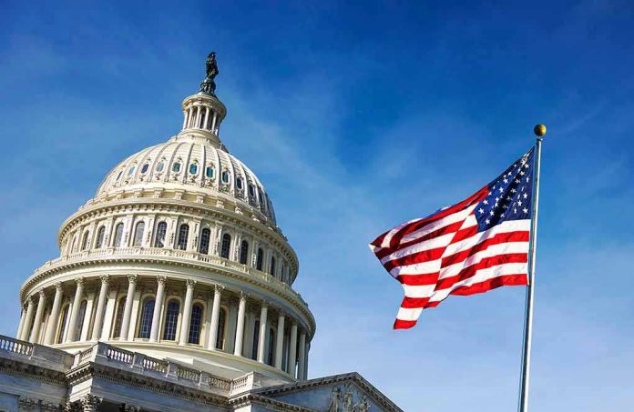 1418358686 U.S. Capitol building with American flag in foreground.