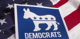 Democratic Leader Endorses SOCIALIST — Party Implodes! Democrats logo on American flag background