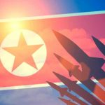 N.Korea FIRES Missile as Trump ARRIVES – Calculated! North Korean flag with missile silhouettes.