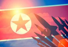 N.Korea FIRES Missile as Trump ARRIVES – Calculated! North Korean flag with missile silhouettes.