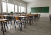 Homeless Surge ROCKS Classrooms – Staggering Number! Empty classroom with desks, chairs, windows, and chalkboard.