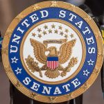 Communist Confession Shakes Senate Race! Sign displaying United States Senate in a government building