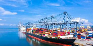 Every Vessel RECEIVES ALARM – Pirate ATTACKS Container ship docked at a busy industrial port.