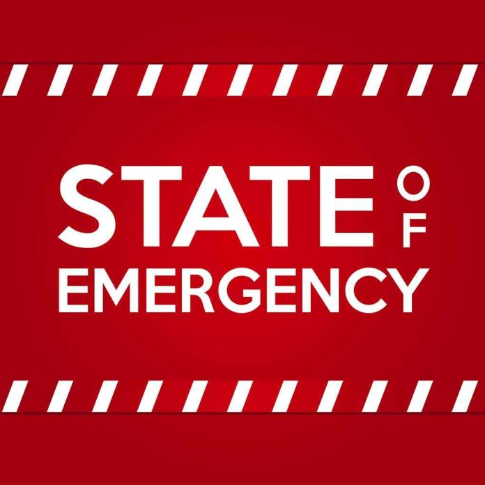 1680535873 STATE OF EMERGENCY in bold white text on red background.
