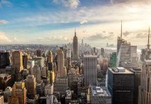 Mamdani Wins – Major Businesses Already Fleeing! New York City skyline with Empire State Building.