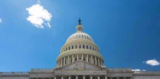 Dem Rep ARRESTED – Accusation Rocks Congress! U.S. Capitol building against a clear blue sky.