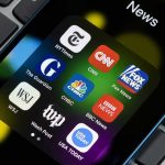 Trump SUES Media Giants – $1BN Lawsuit! News app icons on a smartphone screen.