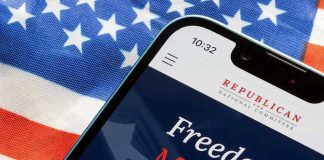 Smartphone and American flag promoting Republican National Committee.
