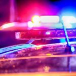 Top Judge ARRESTED – Night of Chaos! Police car lights flashing at night.