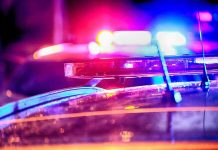 Top Judge ARRESTED – Night of Chaos! Police car lights flashing at night.