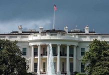 Drug Price CUT – Major Trump Deal White House with American flag and fountain, stormy sky.
