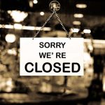 Iconic Brand SHUTTING DOWN—Nobody Saw This Coming Closed sign hanging in a shop window.