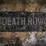 Innocent Man FREED After 30 Years on Death Row Weathered Death Row sign on aged concrete wall