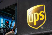 UPS delivery truck driver at traffic light