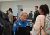 Violent Assault SHOCKS Airport – TSA Agent Attacked, Officer STABBED! TSA agent checks passengers documents at airport security.