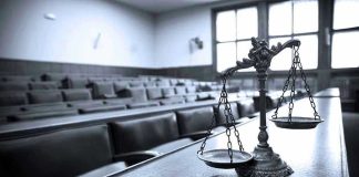 Shocking Maxwell Files Unsealed: Elite Panic Ensues Scales of justice in an empty courtroom.