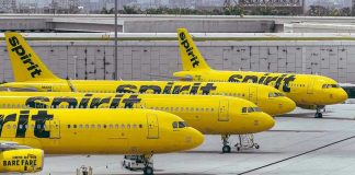 Yellow airplanes parked on the airport tarmac.
