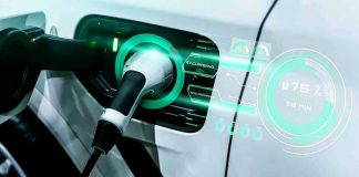 Electric car charging with futuristic display interface.