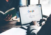 Google’s AI Under Siege: Huge EU Probe Launched Laptop on Google homepage, person reading a book.