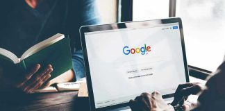 Laptop on Google homepage, person reading a book.