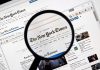 NY Times Caught in Racial Rant – Inflammatory Comments! Magnifying glass over The New York Times website.