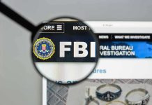 FBI Issues ALERT – Terrifying New Kidnapping Trend FBI website shown through magnifying glass.