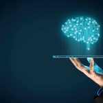 Tech Revolution Wipeout: Jobs Vanishing by 2026 Hand holding tablet projecting digital brain hologram.