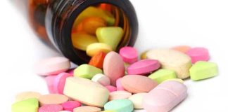 750 Daily Hospitalizations: The Hidden Pill Problem A variety of colorful pills and tablets spilled from a brown medicine bottle