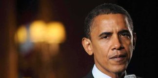 Individual speaking into a microphone at an event